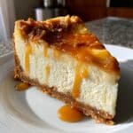 Apple Cider Cheesecake on a fall-themed table in natural lighting