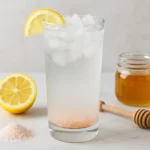 salt and ice trick recipe in a tall glass with lemon