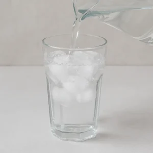 pouring water over ice for salt and ice trick recipe