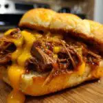 slow cooker beef cheddar sandwiches