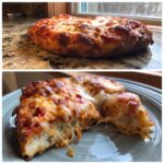 A close-up of a baked sourdough discard pizza crust with melted cheese and tomato sauce.